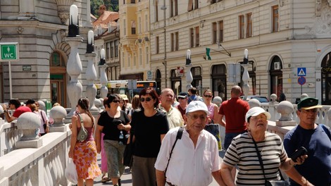 Ljubljana turisti Tromostovje